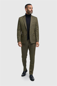 Man wearing a green suit with a black turtleneck and shoes on a white background